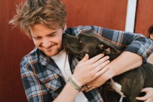 dog hugging owner